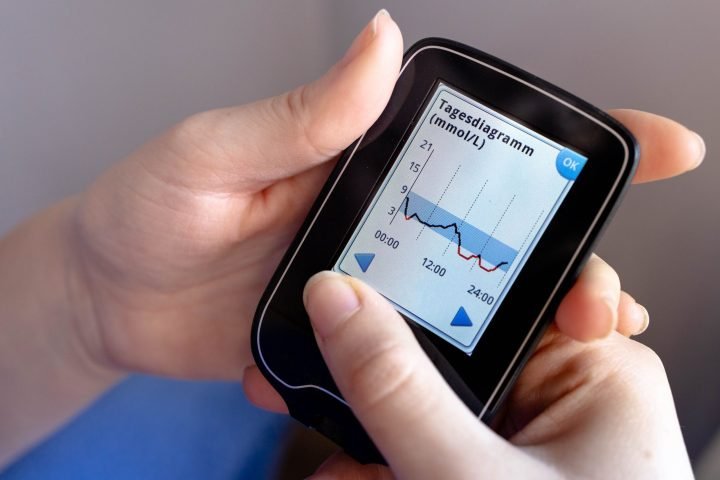 Smartphone displaying a glucose monitoring chart